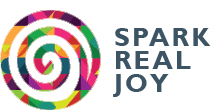 Spark Real Joy logo, a colourful circular spiral in the shape of quilling paper art.